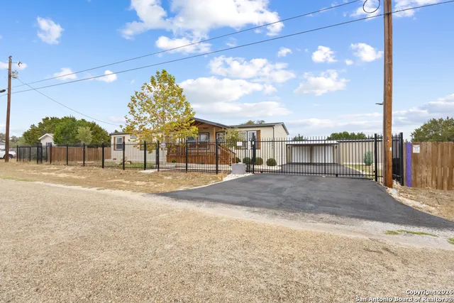 a view of swimming pool with a patio