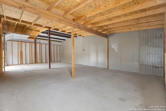 a view of a room with wooden walls