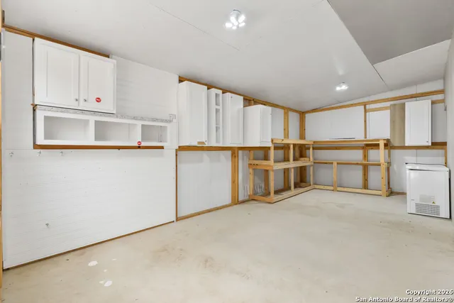 a view of a kitchen with electric appliances
