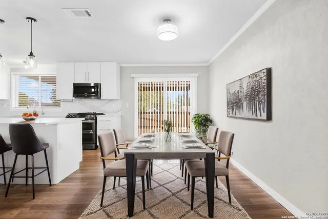 a dining room with furniture and window
