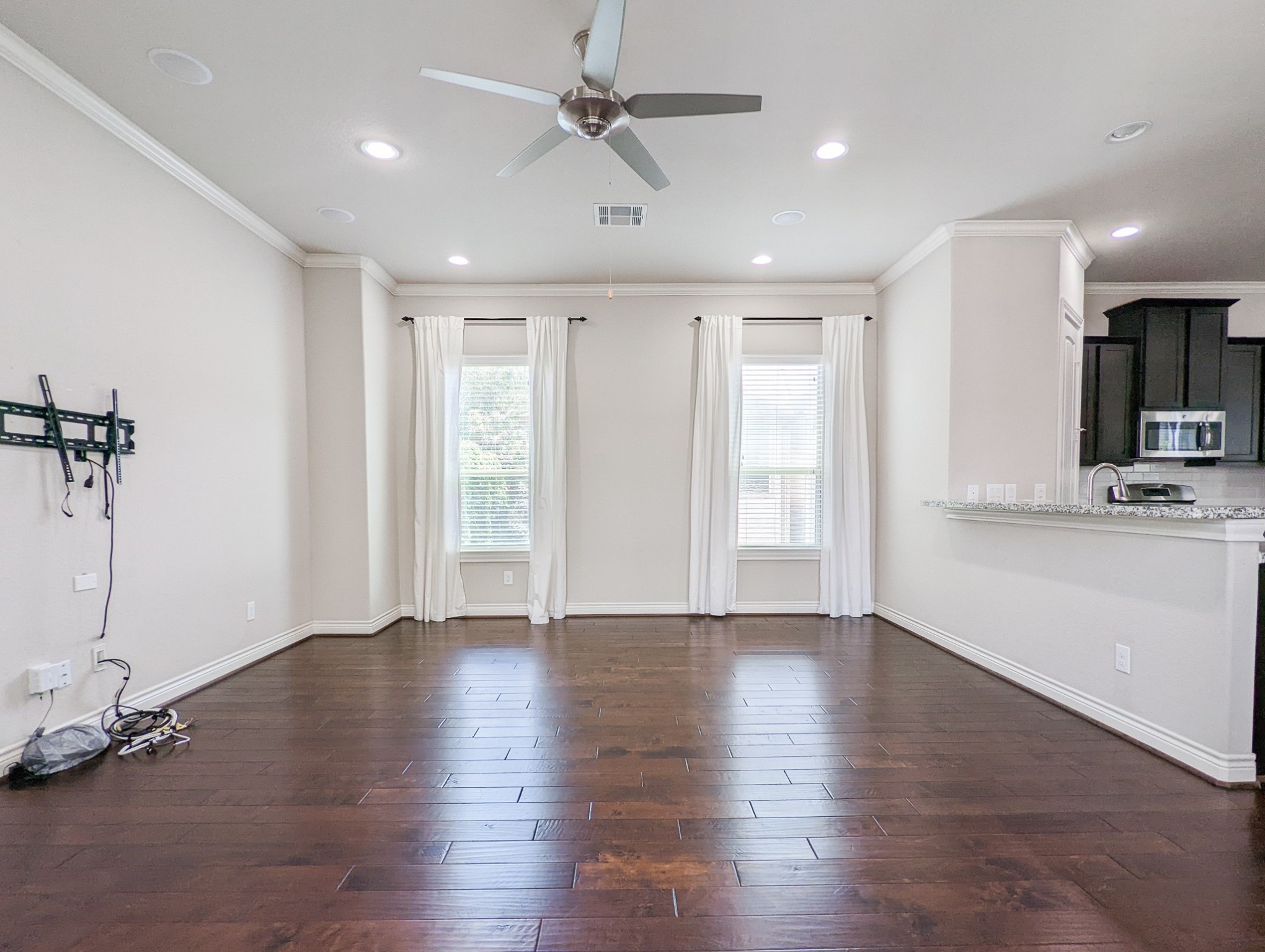 5323 Kiam Street Houston, TX 77007 - Photo 11 of 28 a view of an empty room with a window and wooden floor