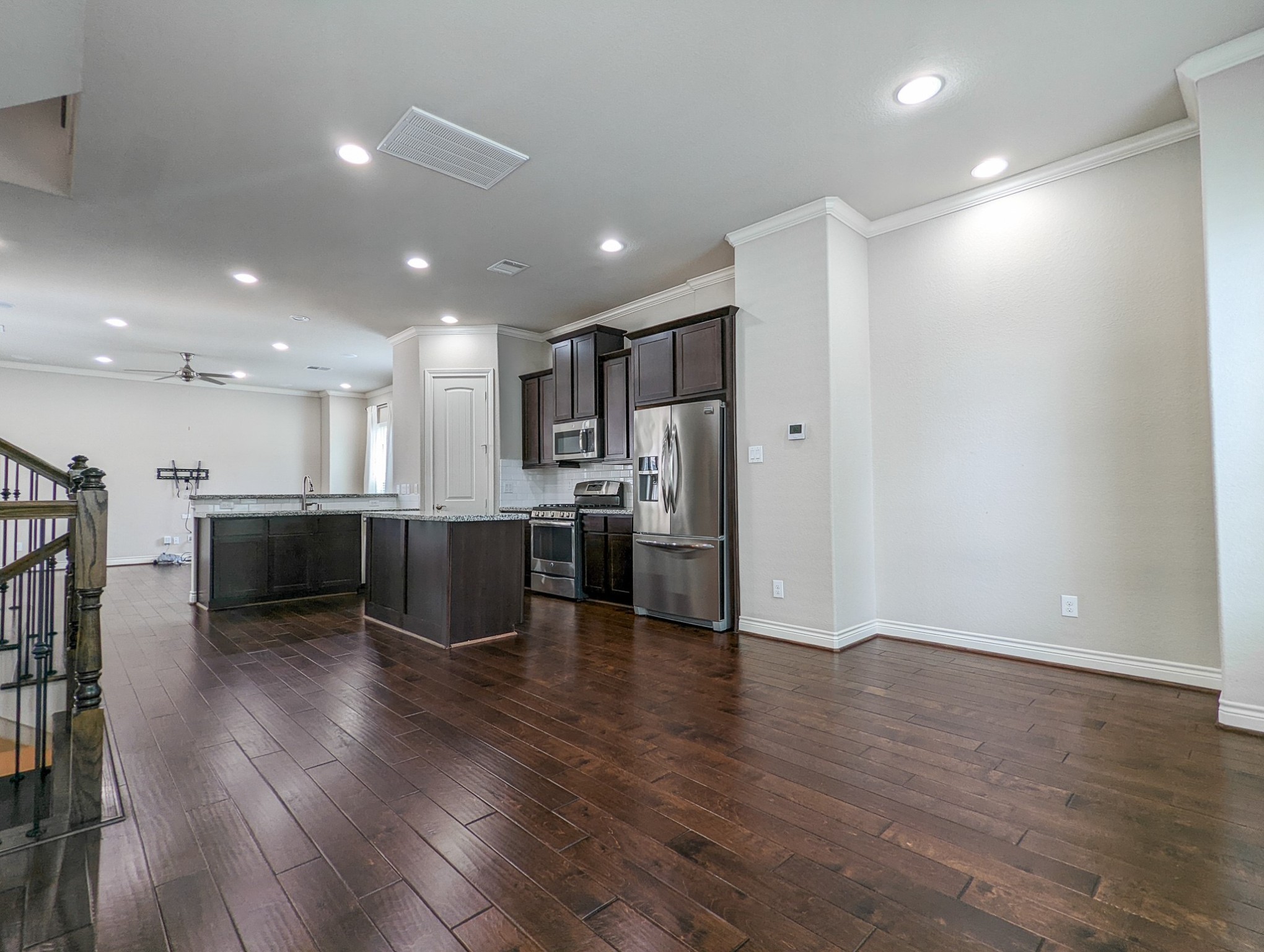 5323 Kiam Street Houston, TX 77007 - Photo 14 of 28 a view of kitchen with stainless steel appliances refrigerator microwave and stove