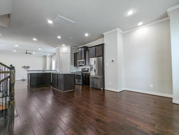 a kitchen with a refrigerator and a microwave