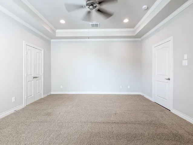 a bathroom with a granite countertop sink a large mirror and a shower