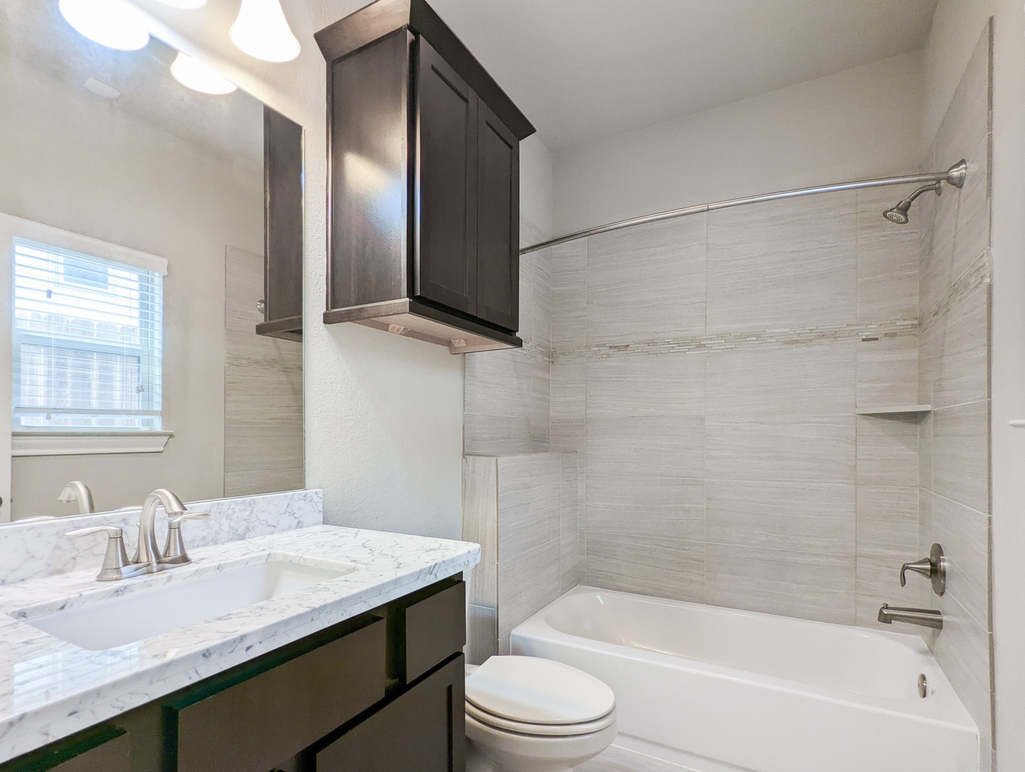 5323 Kiam Street Houston, TX 77007 - Photo 6 of 28 a bathroom with a granite countertop sink toilet and shower