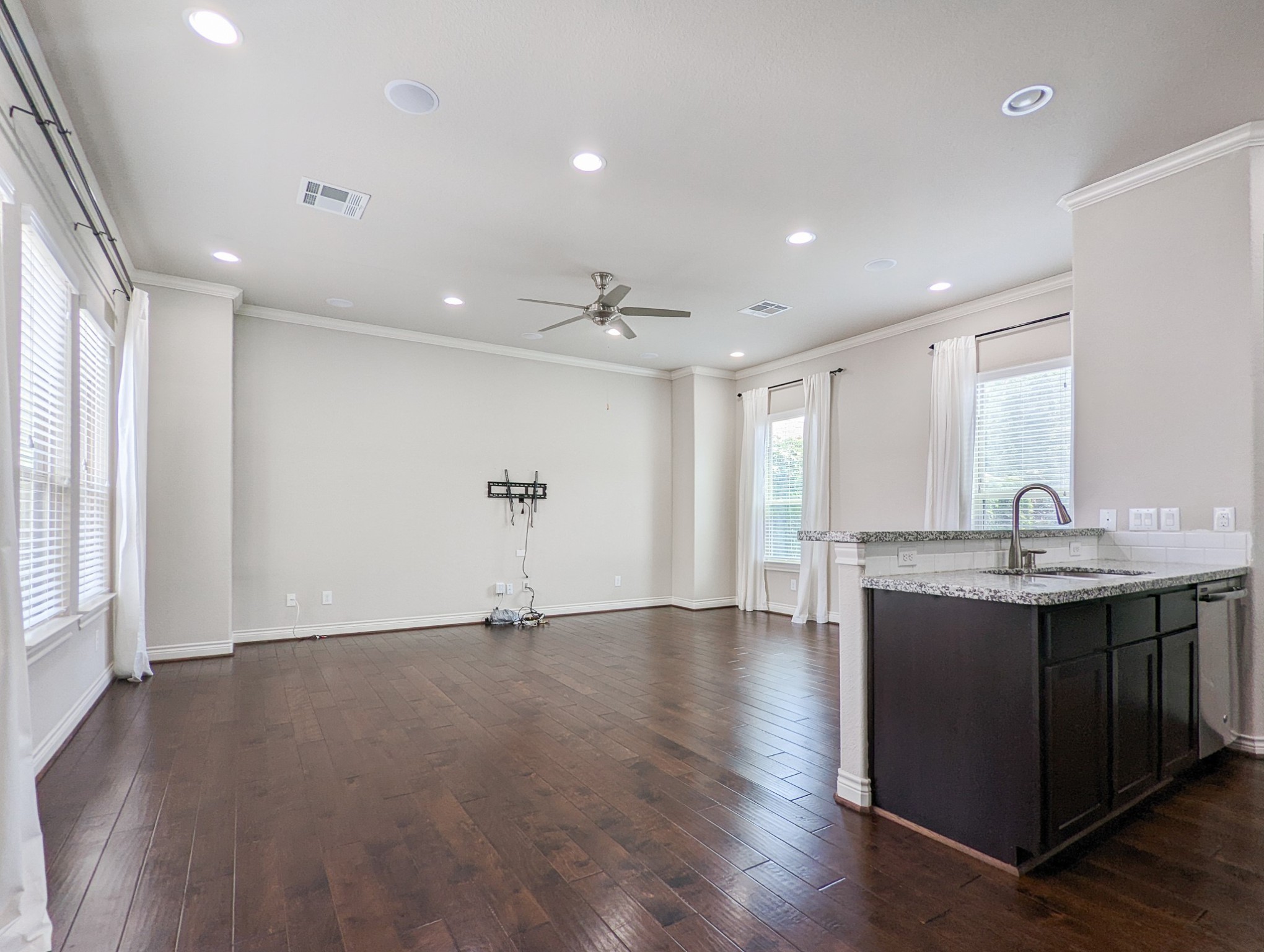 5323 Kiam Street Houston, TX 77007 - Photo 9 of 28 a view of a big room with wooden floor windows and chandelier