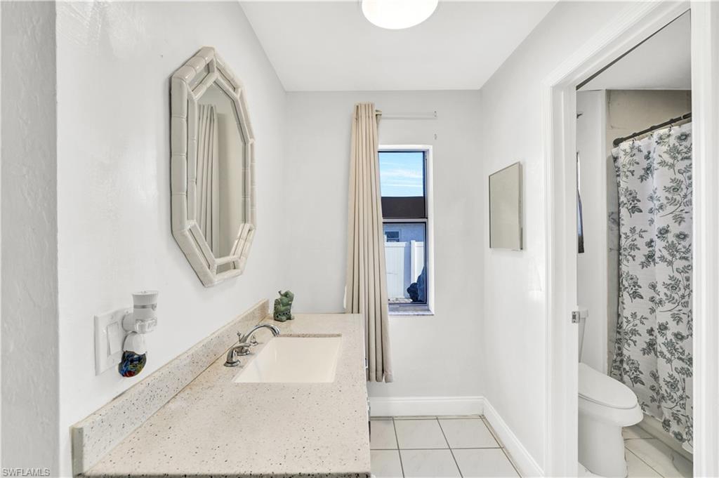 2540 47th Terrace Southwest Naples, FL 34116 - Photo 15 of 17 a bathroom with a bathtub and a shower