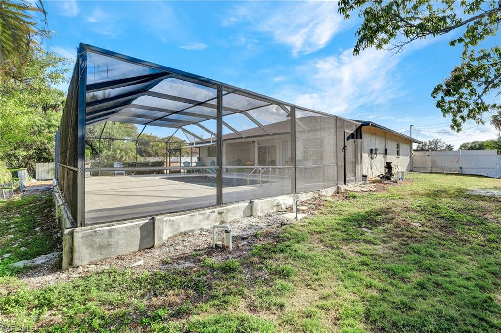 2540 47th Terrace Southwest Naples, FL 34116 - Photo 16 of 17 a view of a house with a yard