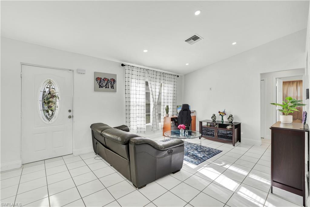 2540 47th Terrace Southwest Naples, FL 34116 - Photo 4 of 17 a living room with furniture