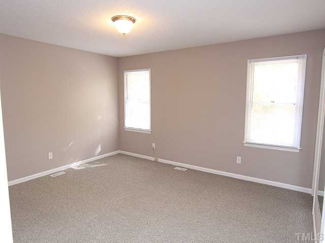 2617 Salisbury Raleigh, NC 27613 - Photo 9 of 11 an empty room with a window
