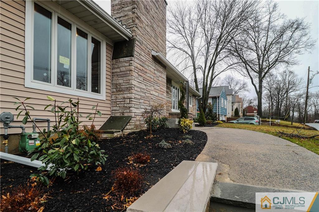355 Chain O' Hills Road Colonia, NJ 07067 - Photo 2 of 25 a view of a yard with plants and trees