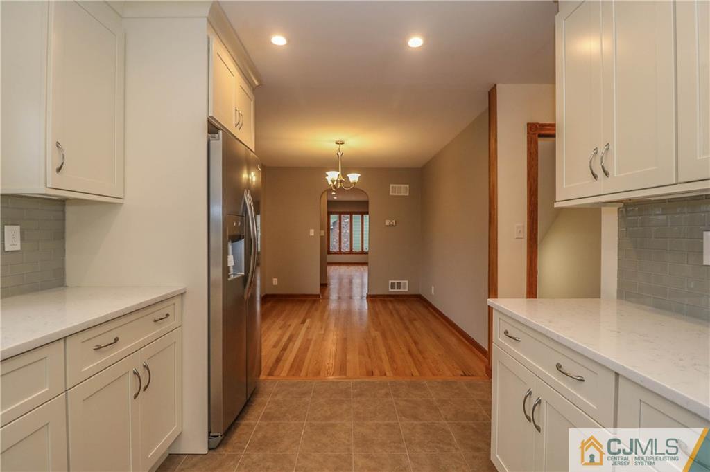 355 Chain O' Hills Road Colonia, NJ 07067 - Photo 15 of 25 a bathroom with a sink and a mirror