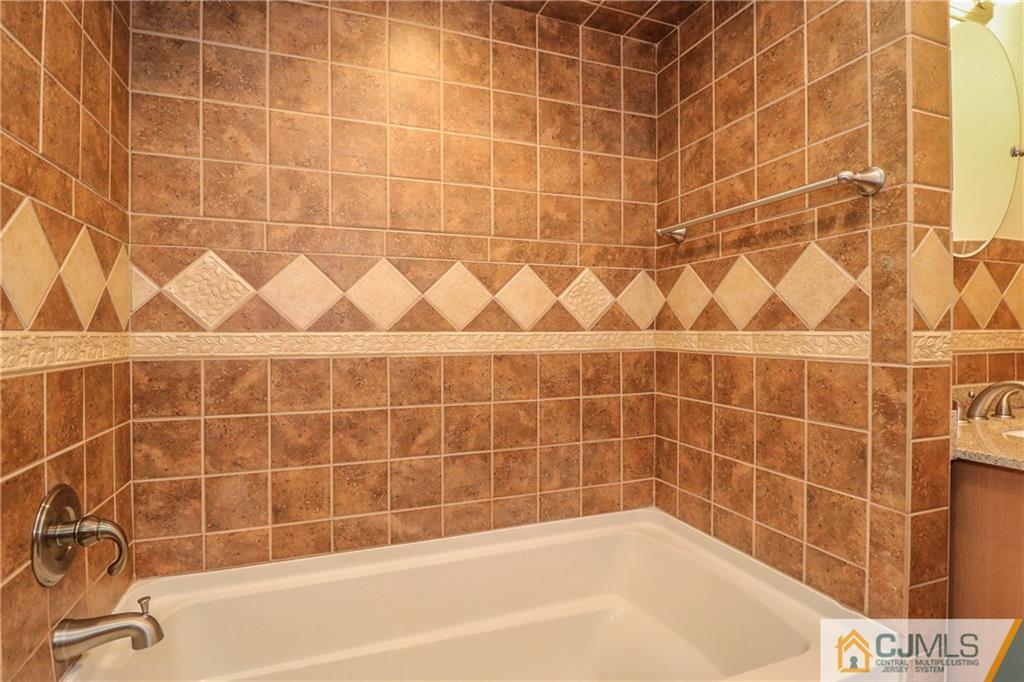 355 Chain O' Hills Road Colonia, NJ 07067 - Photo 21 of 25 a bathroom with a bathtub