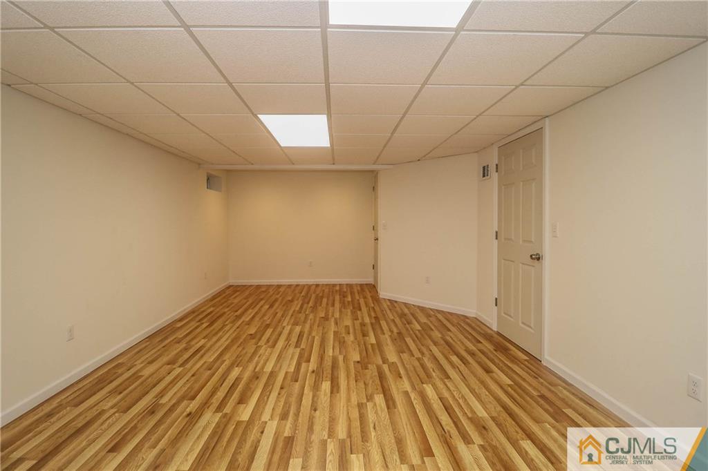355 Chain O' Hills Road Colonia, NJ 07067 - Photo 22 of 25 a view of empty room with wooden floor