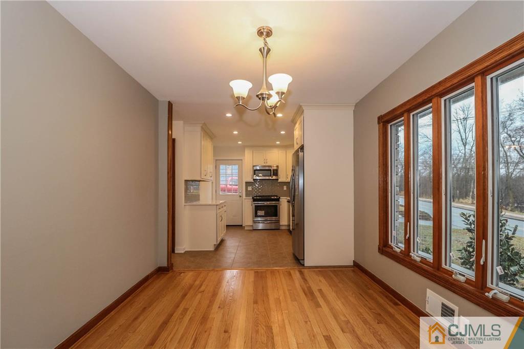 355 Chain O' Hills Road Colonia, NJ 07067 - Photo 9 of 25 a view of a house with wooden floor