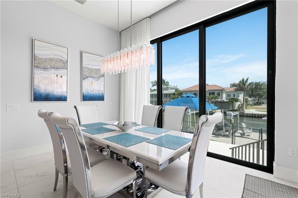 388 Pine Avenue Naples, FL 34108 - Photo 9 of 42 a view of a dining room with furniture window and outside view