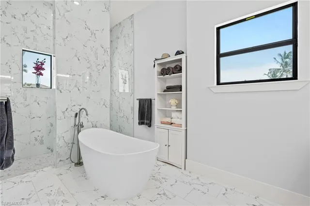 a living room with furniture a window and gym equipment