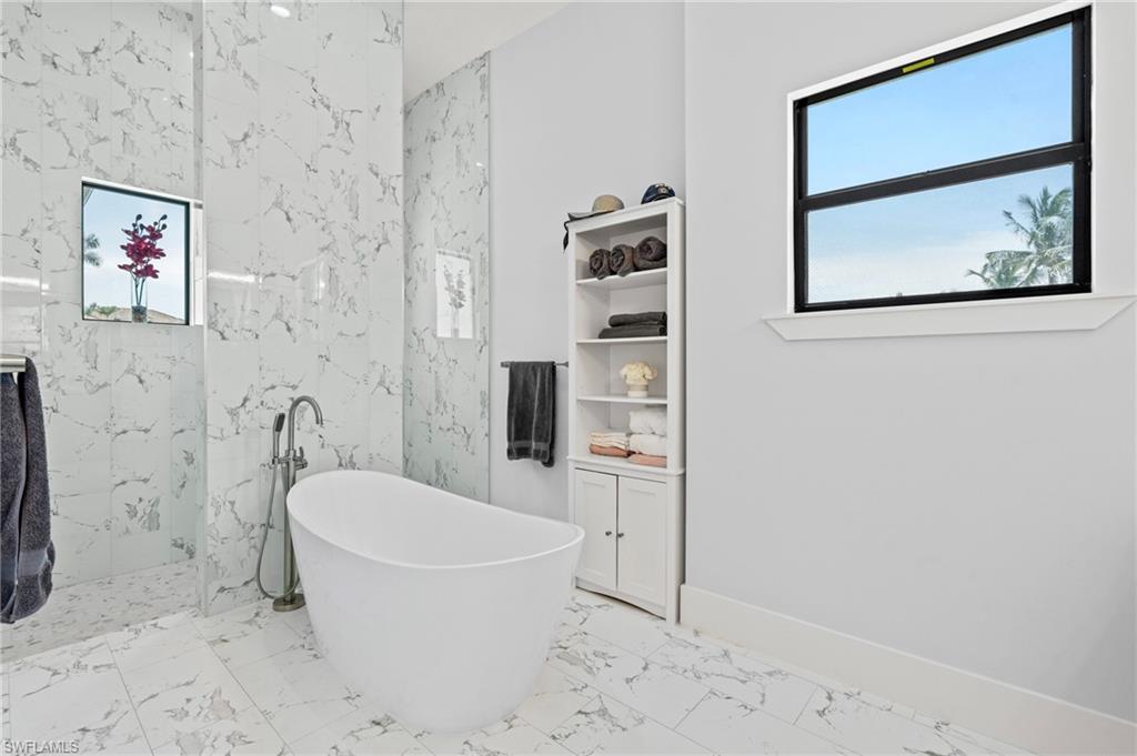 388 Pine Avenue Naples, FL 34108 - Photo 17 of 42 a bathroom with a toilet and a shower