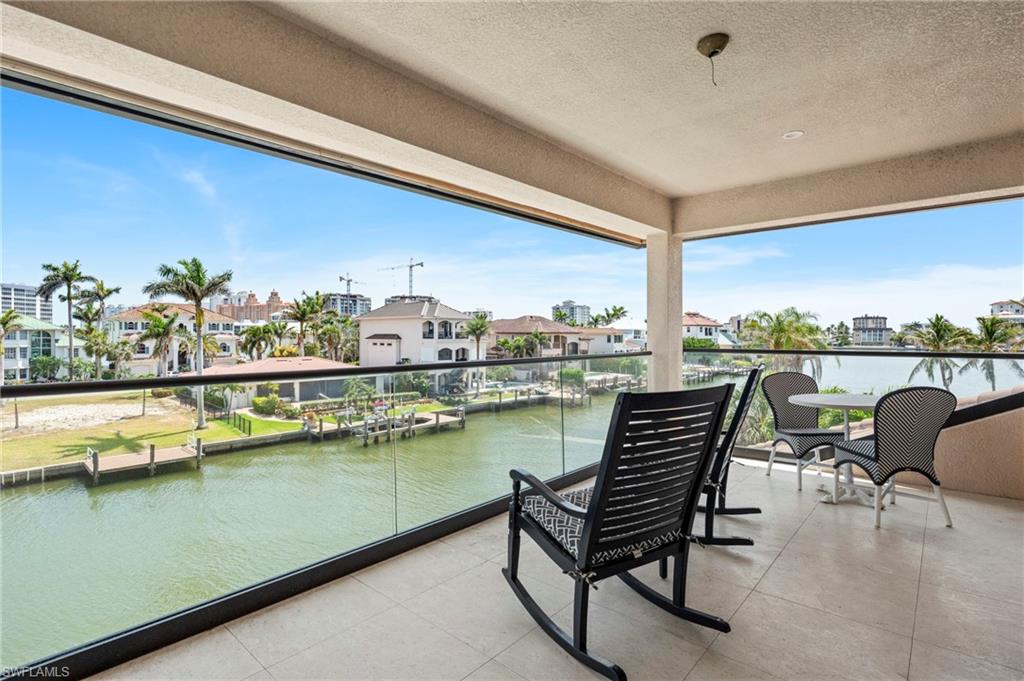 388 Pine Avenue Naples, FL 34108 - Photo 19 of 42 a view of a chairs and table in patio