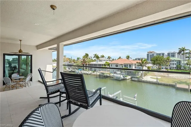 a view of a chairs and table in patio