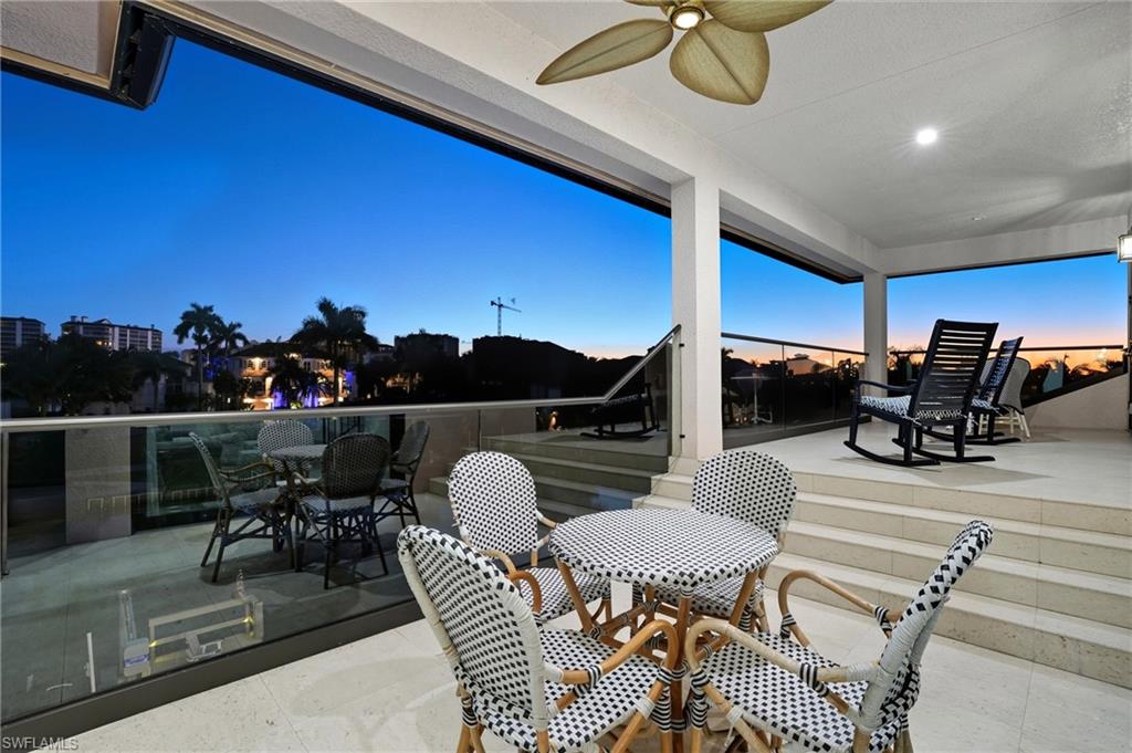 388 Pine Avenue Naples, FL 34108 - Photo 23 of 42 a view of a chairs and tables in patio