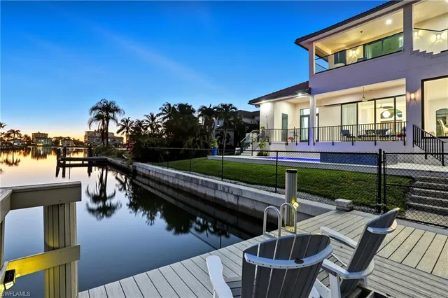 a view of balcony with two chairs and a table