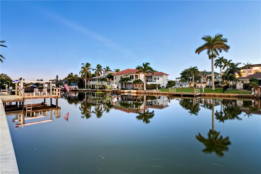 388 Pine Avenue Naples, FL 34108 - Photo 30 of 42 a view of a lake