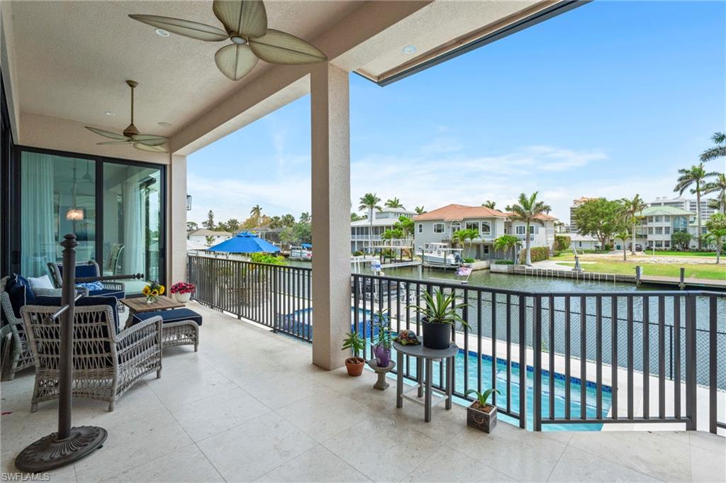 388 Pine Avenue Naples, FL 34108 - Photo 33 of 42 a building outdoor space with patio furniture and garden view