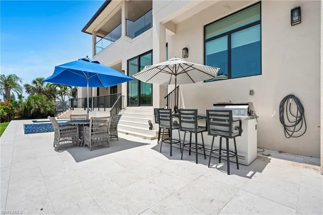 a view of a balcony with furniture