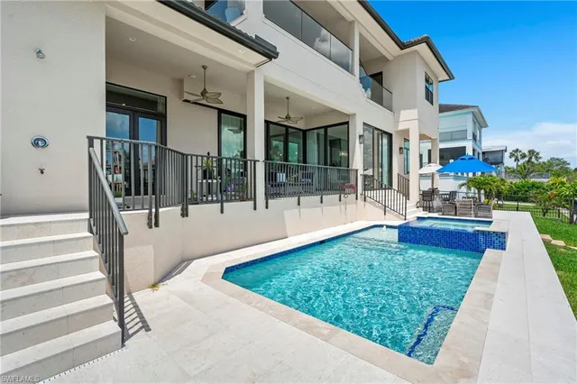 a building outdoor space with patio furniture and garden view