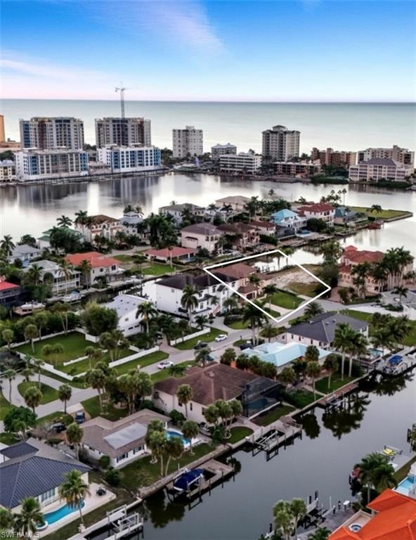 388 Pine Avenue Naples, FL 34108 - Photo 6 of 42 an aerial view of residential houses with outdoor space