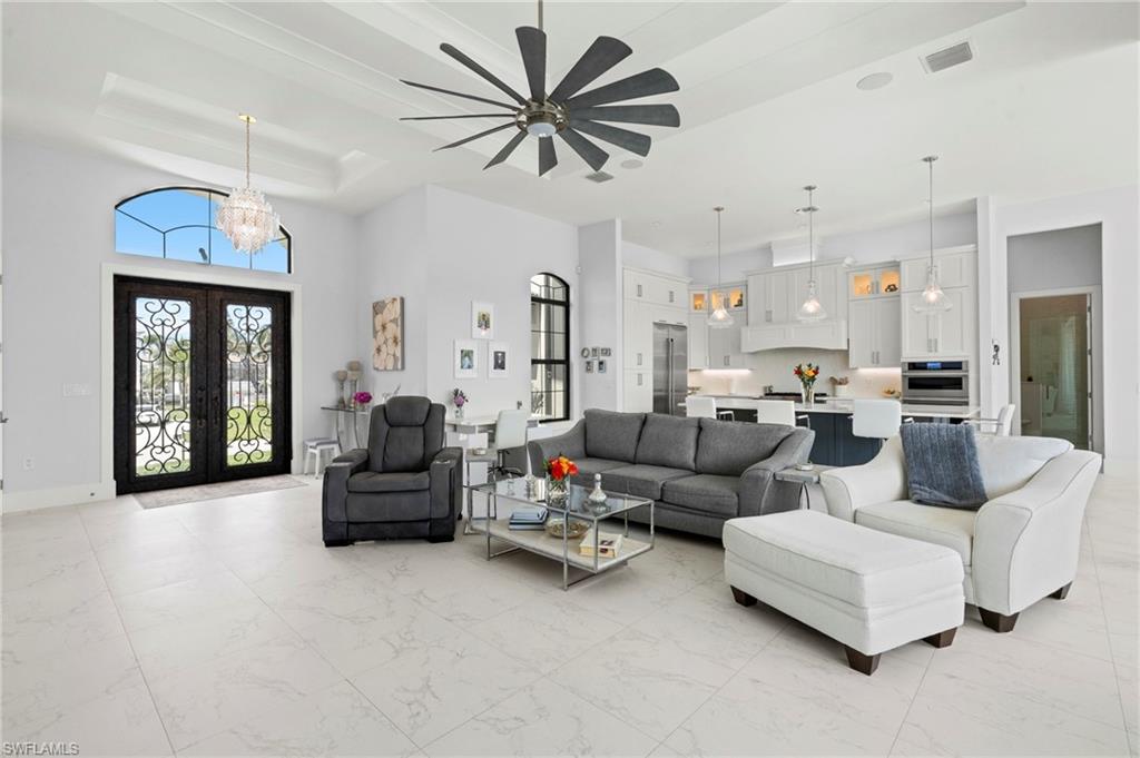 388 Pine Avenue Naples, FL 34108 - Photo 7 of 42 a living room with furniture and a large window