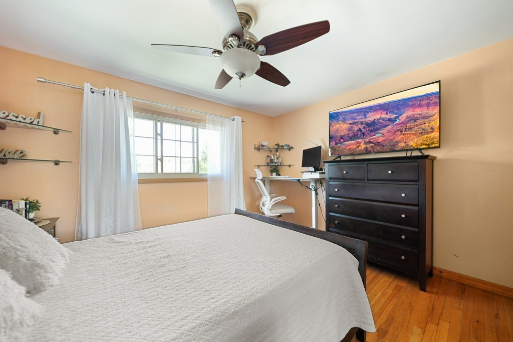 365 West Myrick Avenue Addison, IL 60101 - Photo 24 of 49 a bedroom with a bed and a flat screen tv