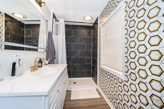 a bathroom with a sink and a shower