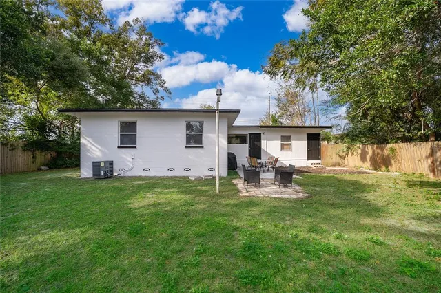 a front view of house with yard and seating area