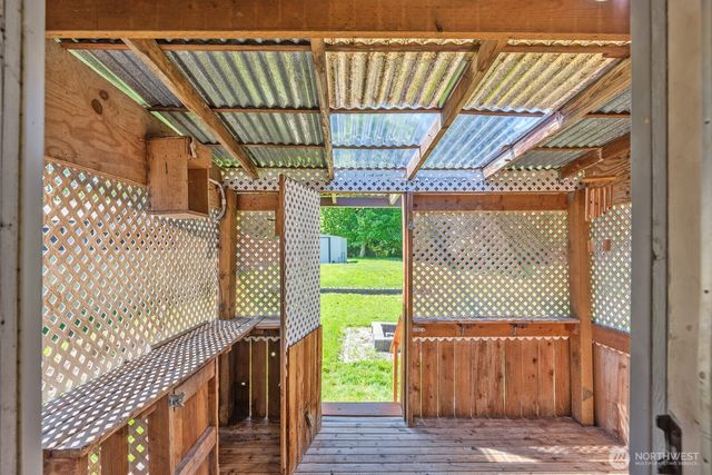 a view of porch with wooden floor