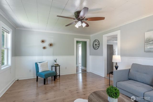 a living room with furniture and a window