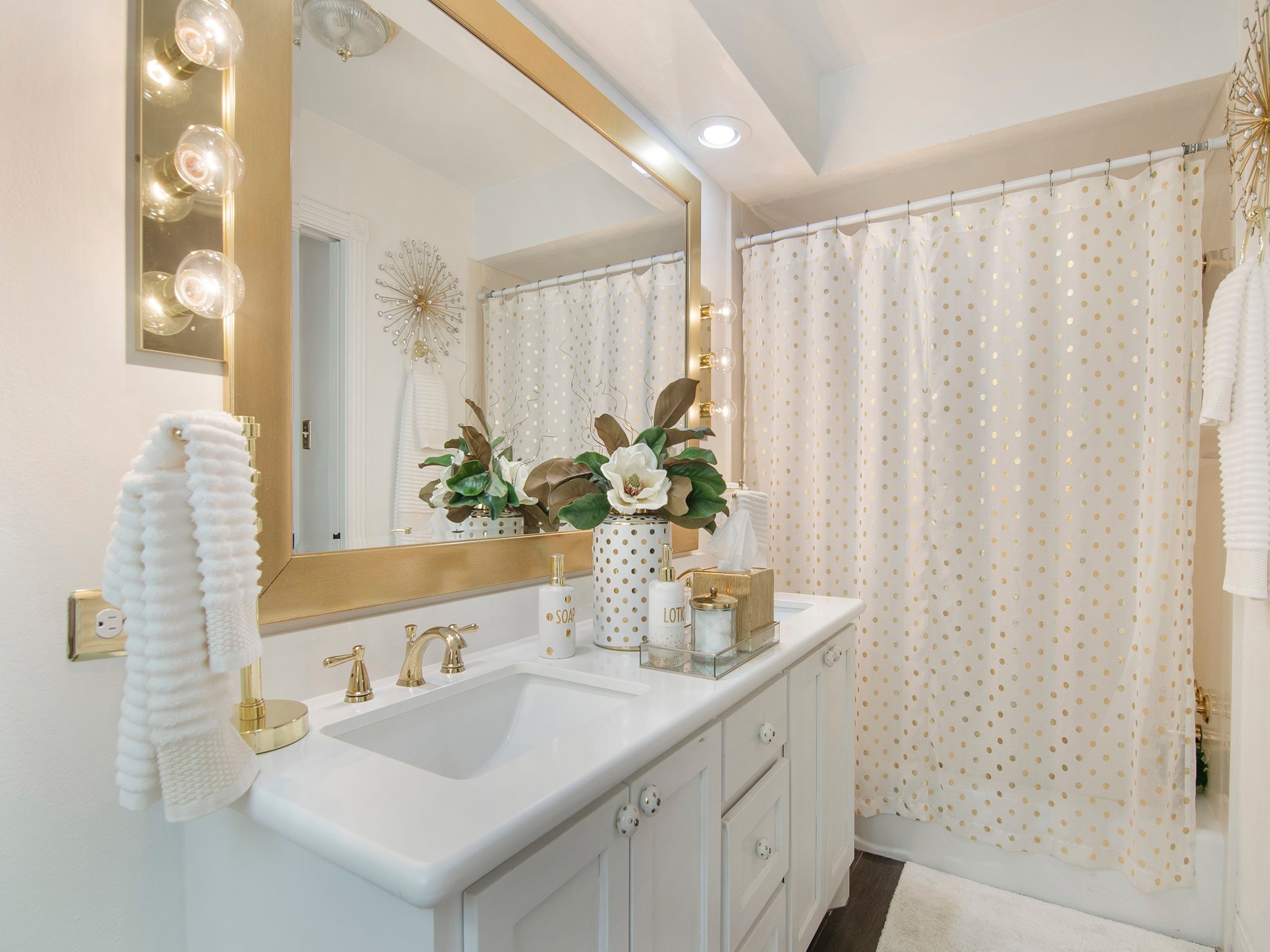 532 Raleigh Drive Conroe, TX 77302 - Photo 12 of 40 Bright primary bathroom features double sink vanity and elegant gold accents.
