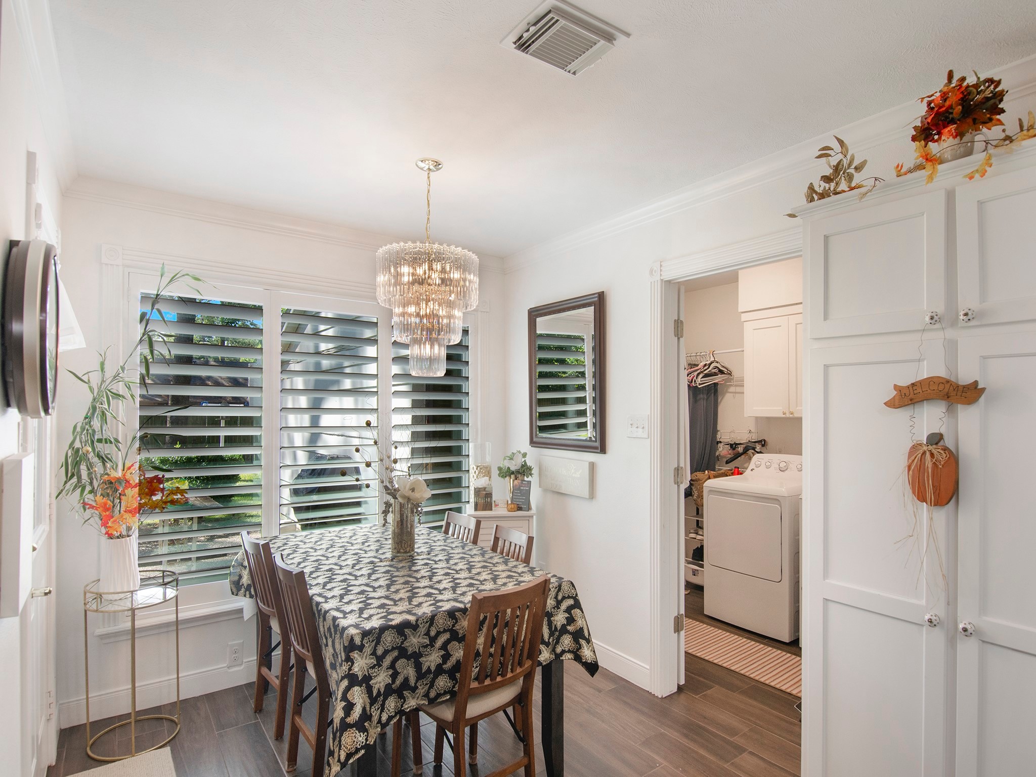 532 Raleigh Drive Conroe, TX 77302 - Photo 16 of 40 Adorable and cozy best describes this breakfast room bathed in natural light. A bright & cheeful room to enjoy casual meals and morning coffee. A few notable features are the beautiful chandelier, classic window shutters and it's conveniently located near the laundry room and half bathroom.