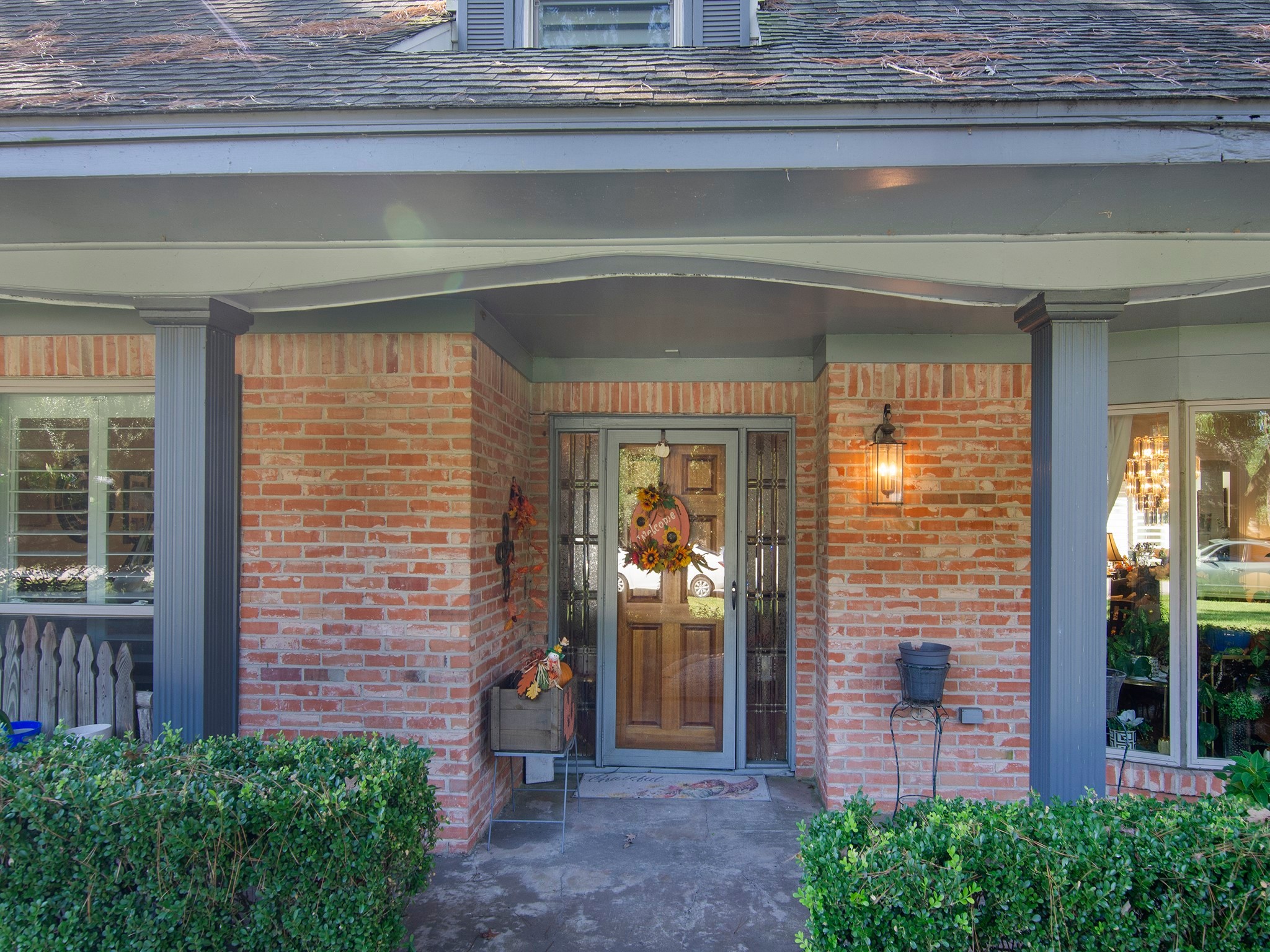 532 Raleigh Drive Conroe, TX 77302 - Photo 2 of 40 Charming covered front porch with a classic brick entryway creates a warm and welcoming curb appeal.