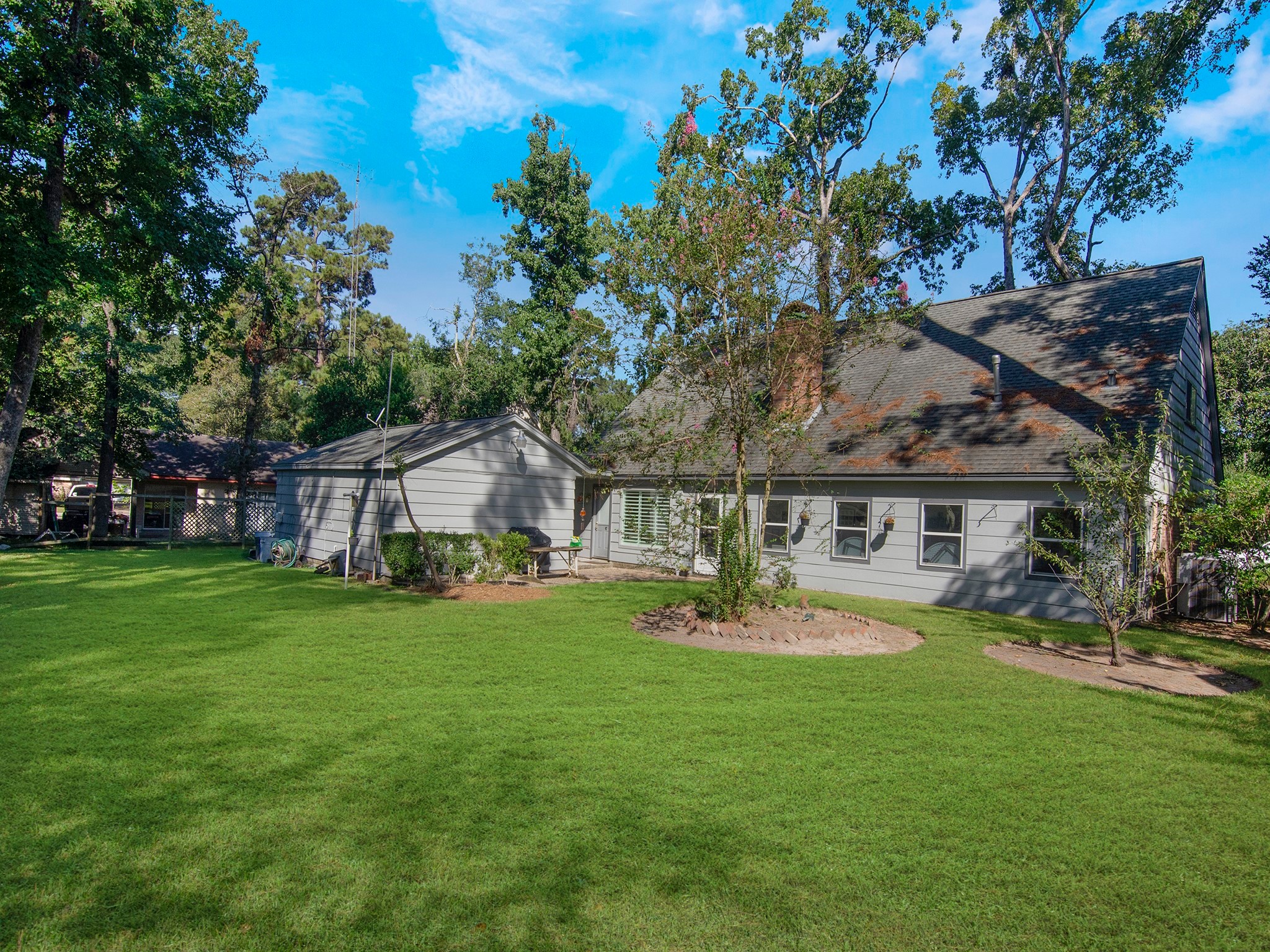 532 Raleigh Drive Conroe, TX 77302 - Photo 30 of 40 a front view of house with a garden and trees
