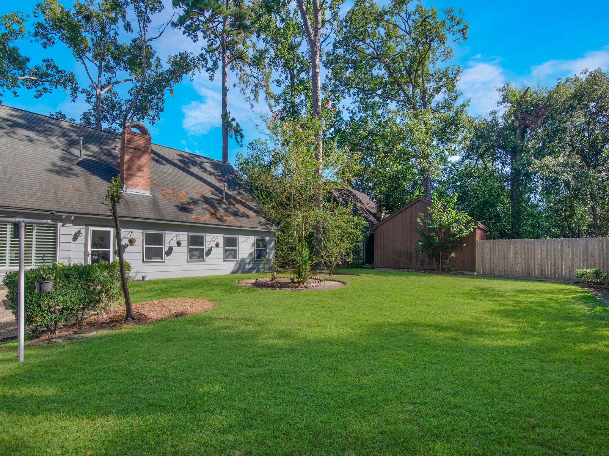 532 Raleigh Drive Conroe, TX 77302 - Photo 31 of 40 a view of a house next to a big yard and large trees