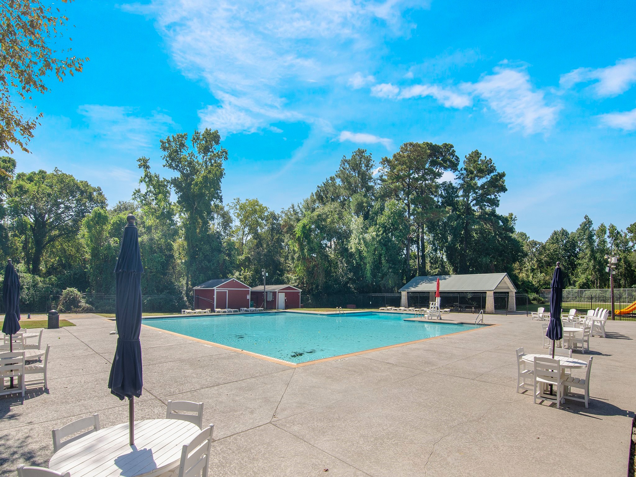 532 Raleigh Drive Conroe, TX 77302 - Photo 35 of 40 a view of a garden with a bench in the patio