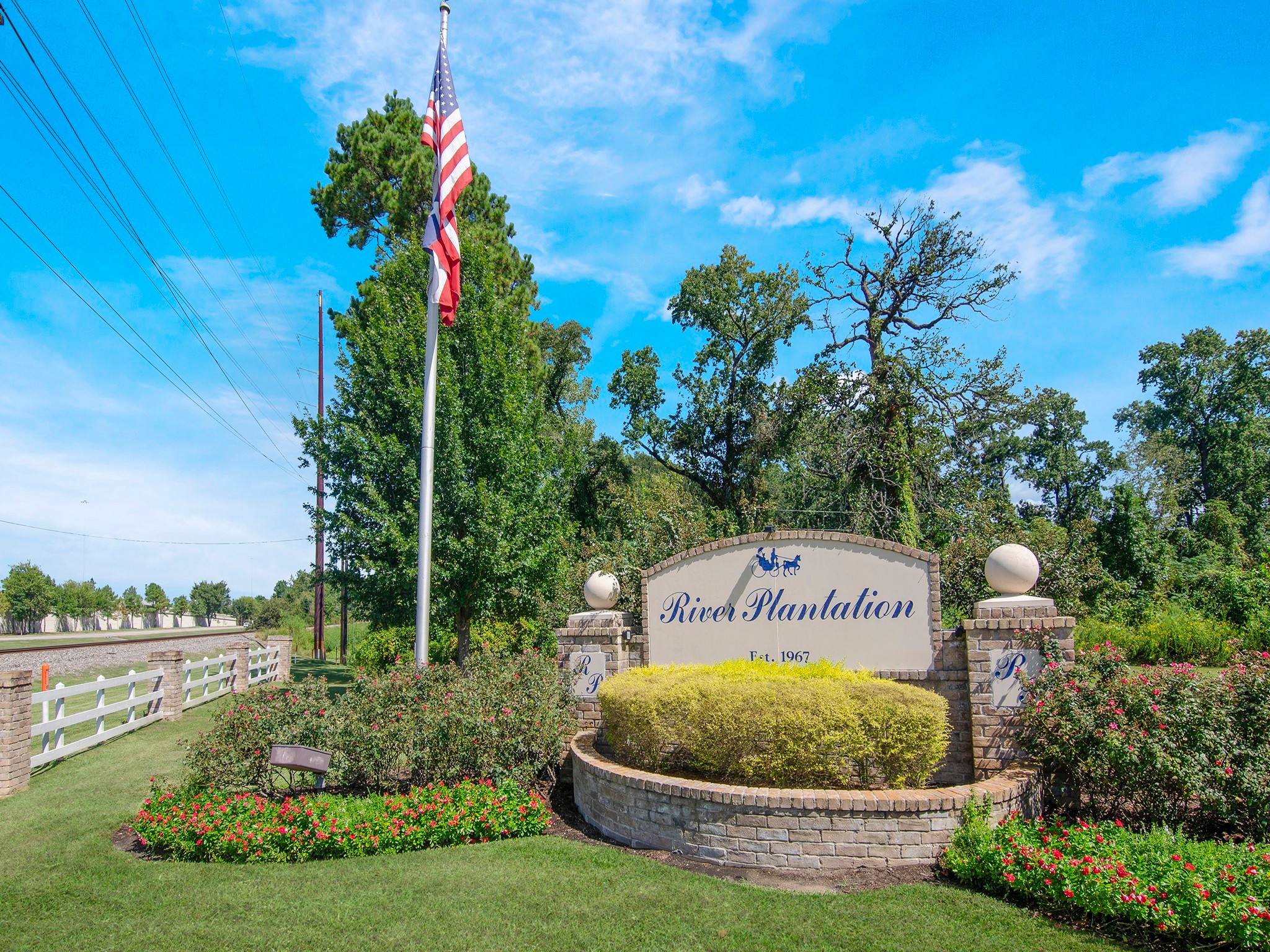 532 Raleigh Drive Conroe, TX 77302 - Photo 38 of 40 a sign that is sitting in front of a house with a big yard