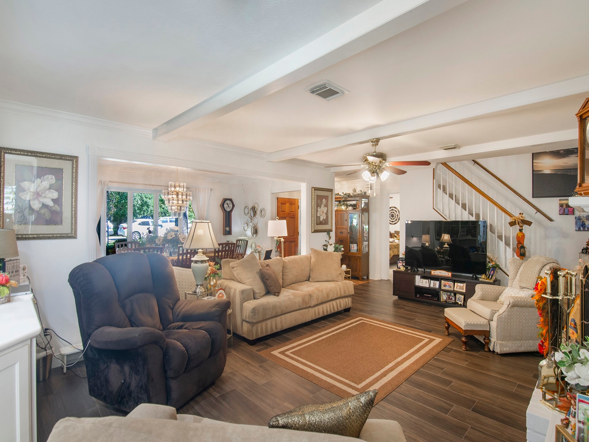 532 Raleigh Drive Conroe, TX 77302 - Photo 9 of 40 a living room with furniture and a flat screen tv