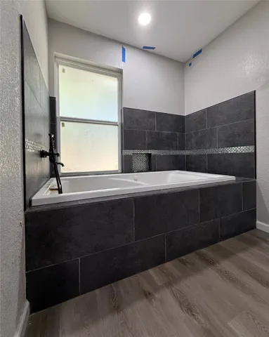 a bathroom with a sink and a window