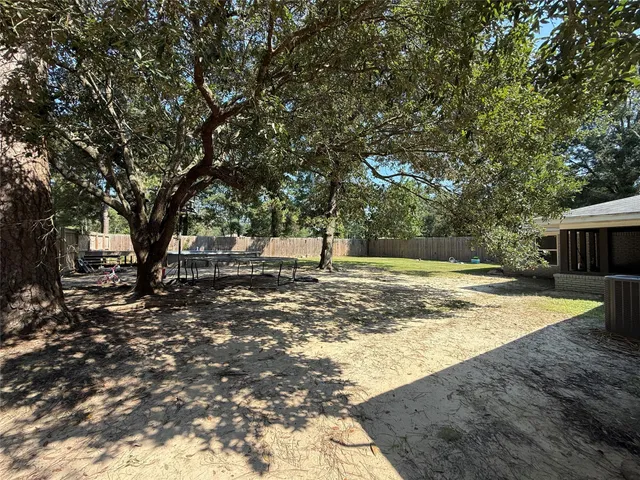 a view of a yard with swimming area