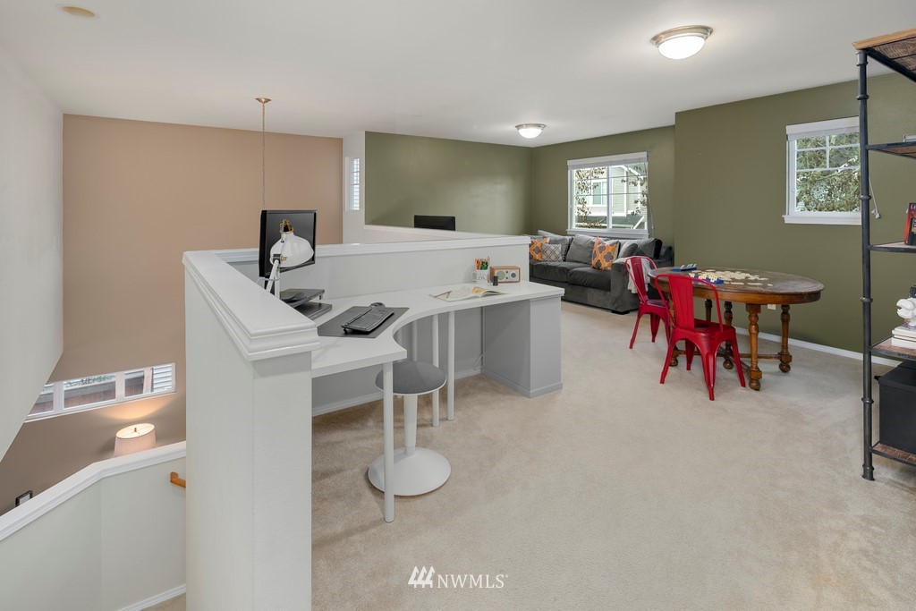 2425 194th Street Southeast, Unit 40 Bothell, WA 98012 - Photo 11 of 20 a living room with furniture and wooden floor