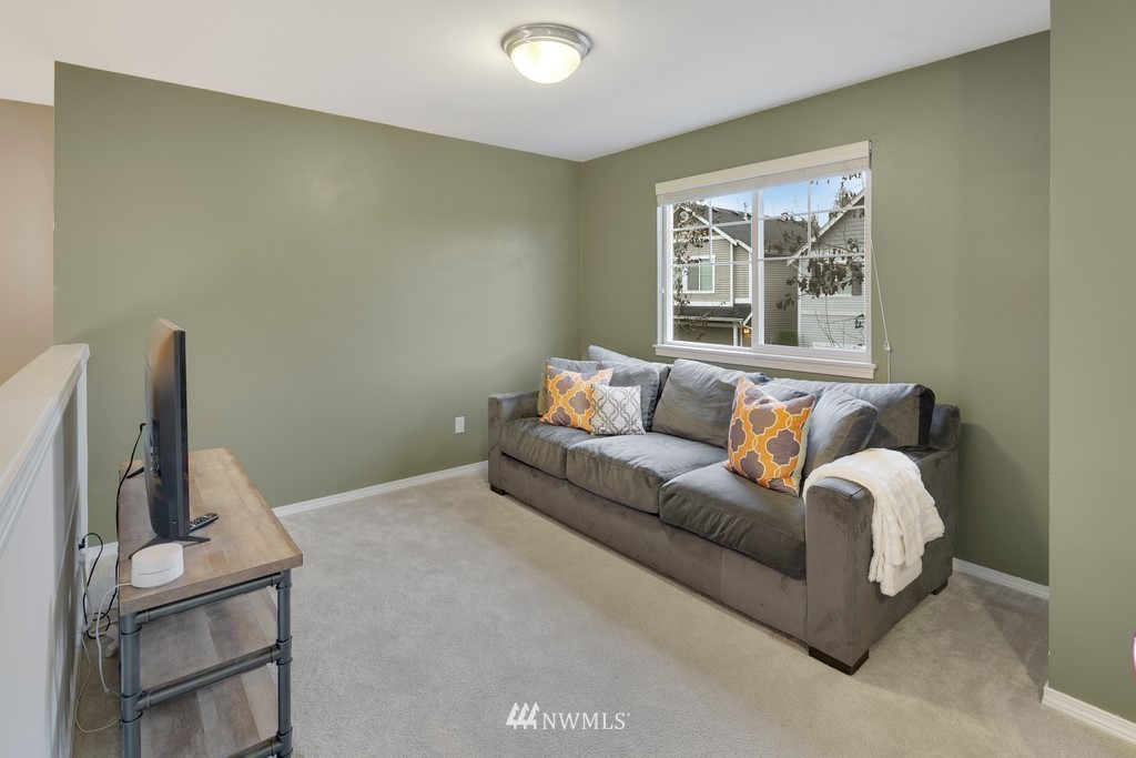 2425 194th Street Southeast, Unit 40 Bothell, WA 98012 - Photo 12 of 20 a living room with furniture and a window