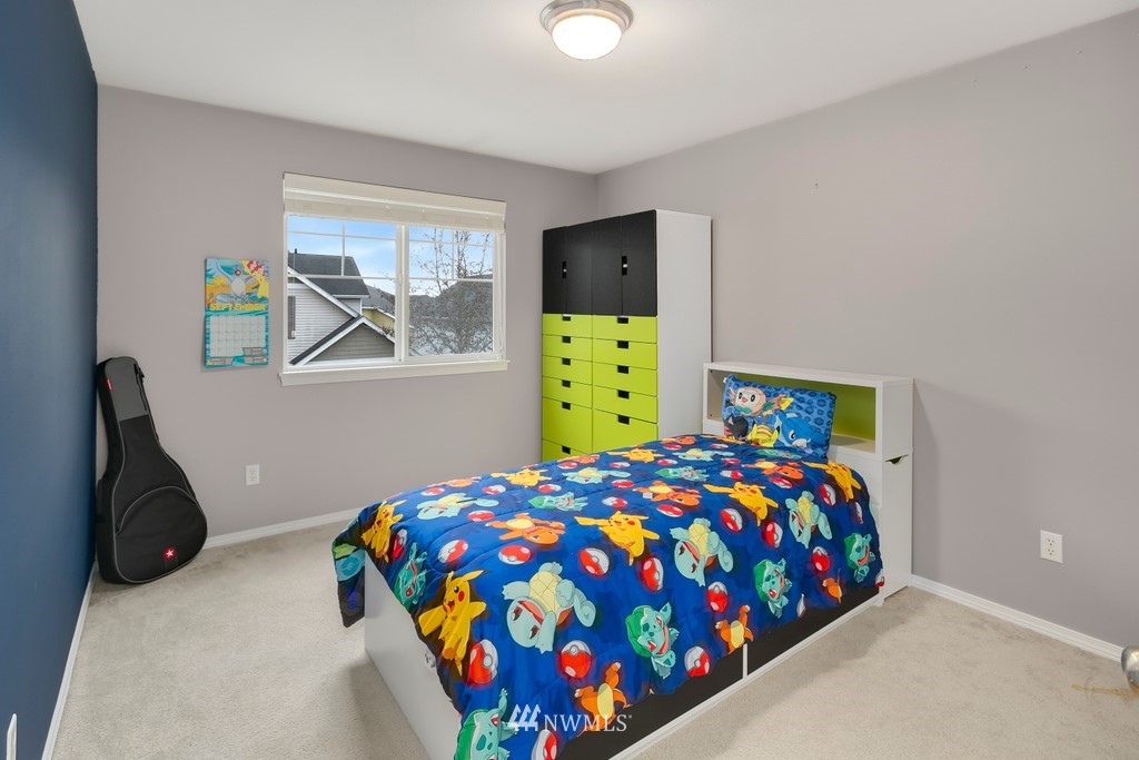 2425 194th Street Southeast, Unit 40 Bothell, WA 98012 - Photo 14 of 20 a bedroom with bed and a window